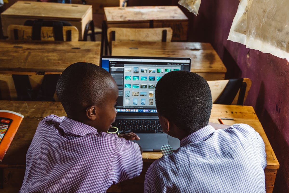 Students operating computer